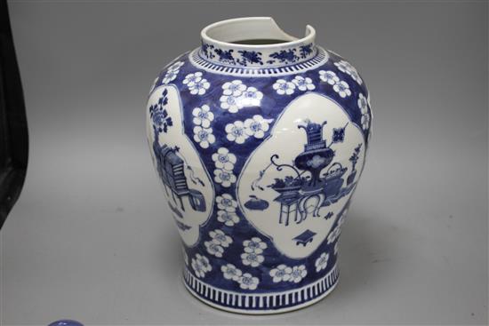 A 19th century Chinese blue and white jar, with panelled decoration, height 28cm and an associated vase lid